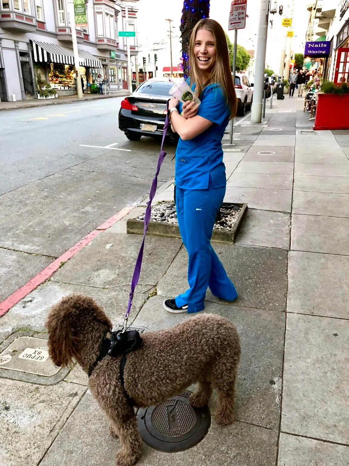 nurse on sidewalk walking dog smiling registered nurse hours 12 hour shifts