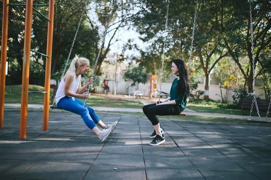 two women on swings facing each other talking things nurses should know