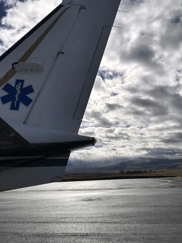 tail of plane on runway flight nursing