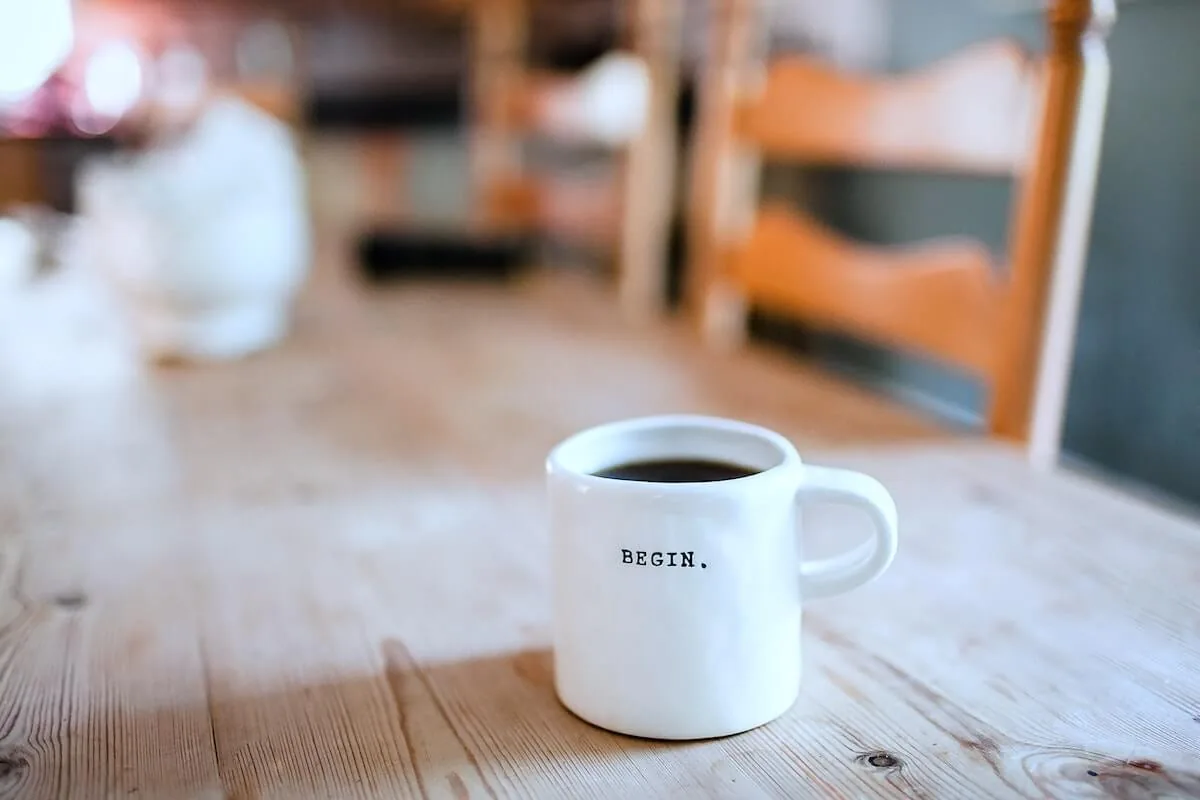 coffee mug with begin written on it sitting on dining room table begin investing for nurses