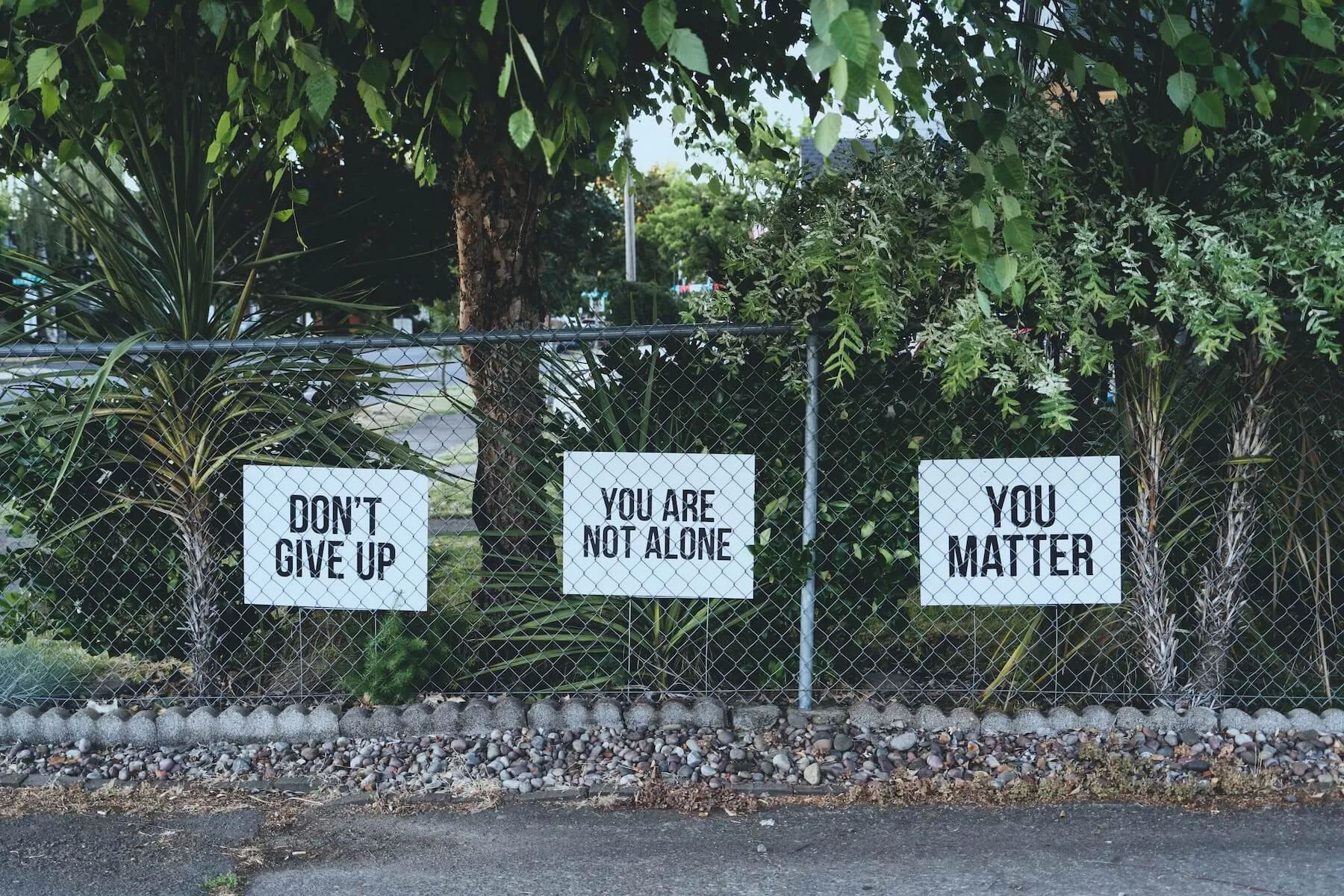 photos of motivational signs on fence mental health awareness month OSU trusted health mental health partnership