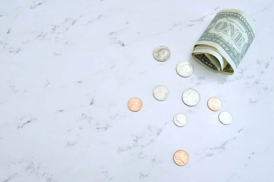 american money on marble table nursing finances