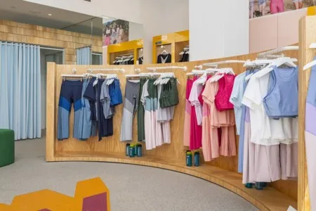 outdoor voices athletic gear on clothing racks in store