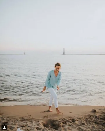 nurse monica gingell on the beach smiling