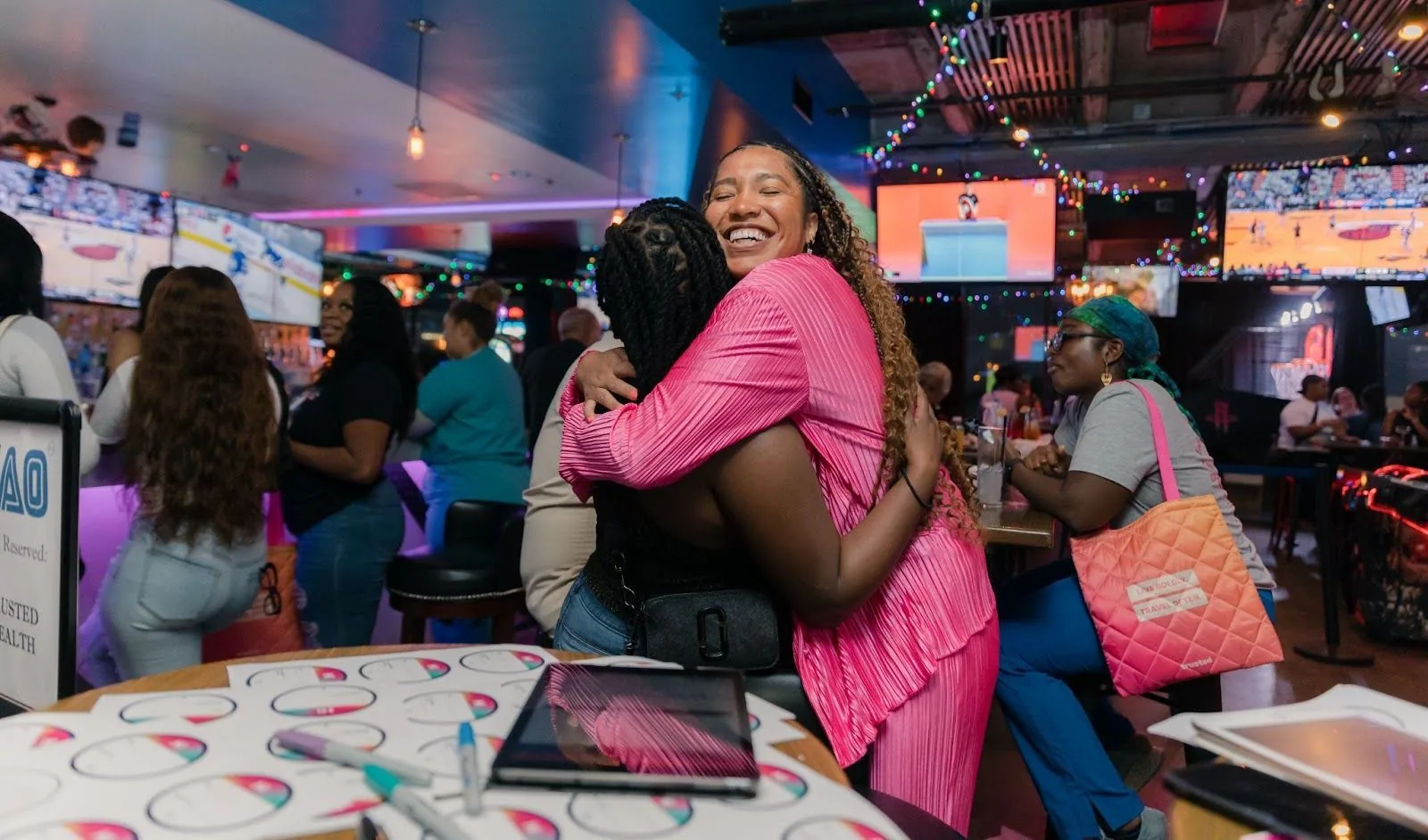 A heartfelt moment captured as Britt, our community leader, embraces a clinician at a Trusted event, symbolizing the compassion, support, and unity found within The Trusted Circle.
