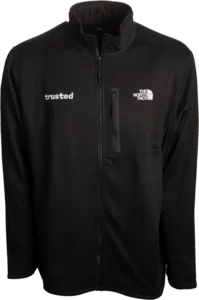 Black North Face full-zip fleece jacket with 'trusted' logo on the front, ideal for surgical techs to keep warm in the cold environment of the operating room.